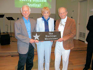 Maggie Peterson Mancuso joined Darling brothers Dean Webb (left) and Mitch Jayne