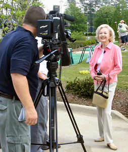Elizabeth MacRae is radiant for a TV interview during the Eagles’ Wings golf tourney.