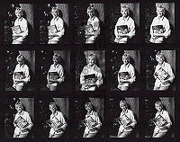 Maggie Proof Sheet - Sitting in Chair Holding Book (Autographed Back) Photo